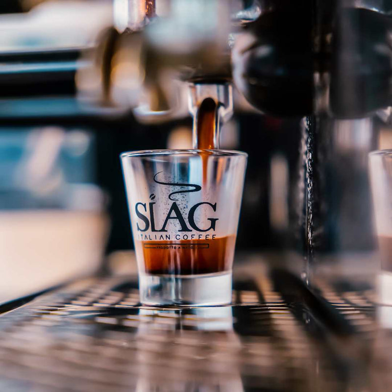 The first drops of espresso